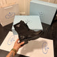 PRADA BRUSHED-LEATHER AND RE-NYLON BOOTS SHINY BLACK
