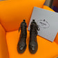 PRADA LOGO PLAQUE ANKLE BOOTS BLACK