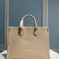 M45595 OnTheGo MM Monogram Empreinte leather white 35cm