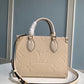 M45653 OnTheGo PM Monogram Empreinte leather white 25cm